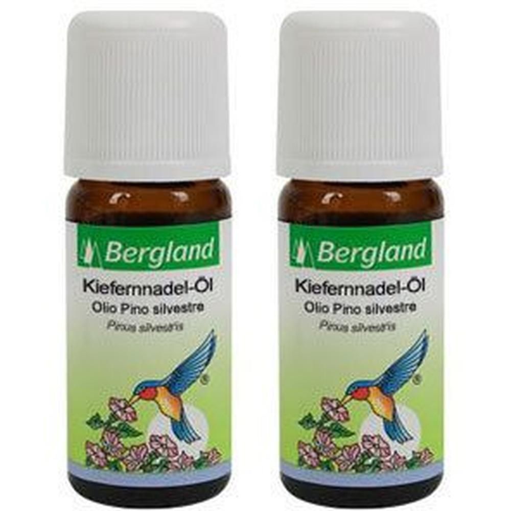 Zwei braune Glasflaschen mit weißen Deckeln. Etiketten mit Text und einem Vogel-Motiv. Aufschrift: Bergland Kiefernnadel-Öl.
