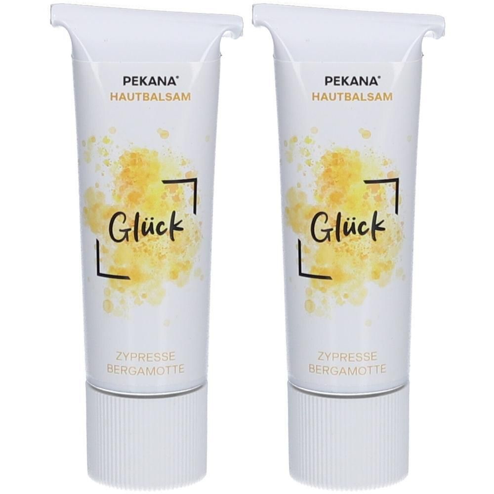 Zwei weiße Tuben mit Produkt. Aufschrift: PEKANA HAUTBALSAM, Glück, Zypresse Bergamotte. Gelbe, aquarellartige Muster.