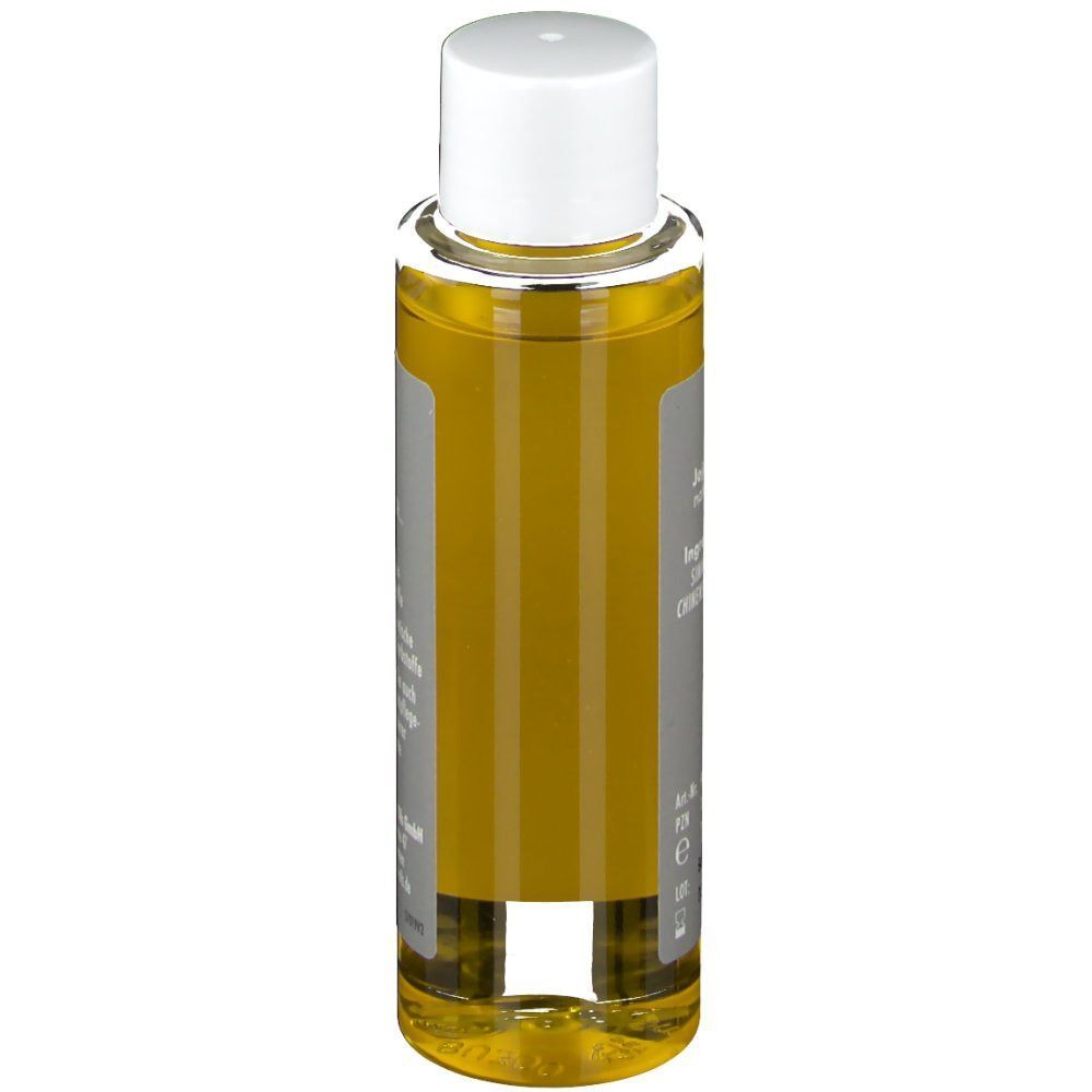 Seitenansicht einer Jojobaöl-Flasche. Graues Etikett mit Text. Transparente Flasche mit gelblicher Flüssigkeit.