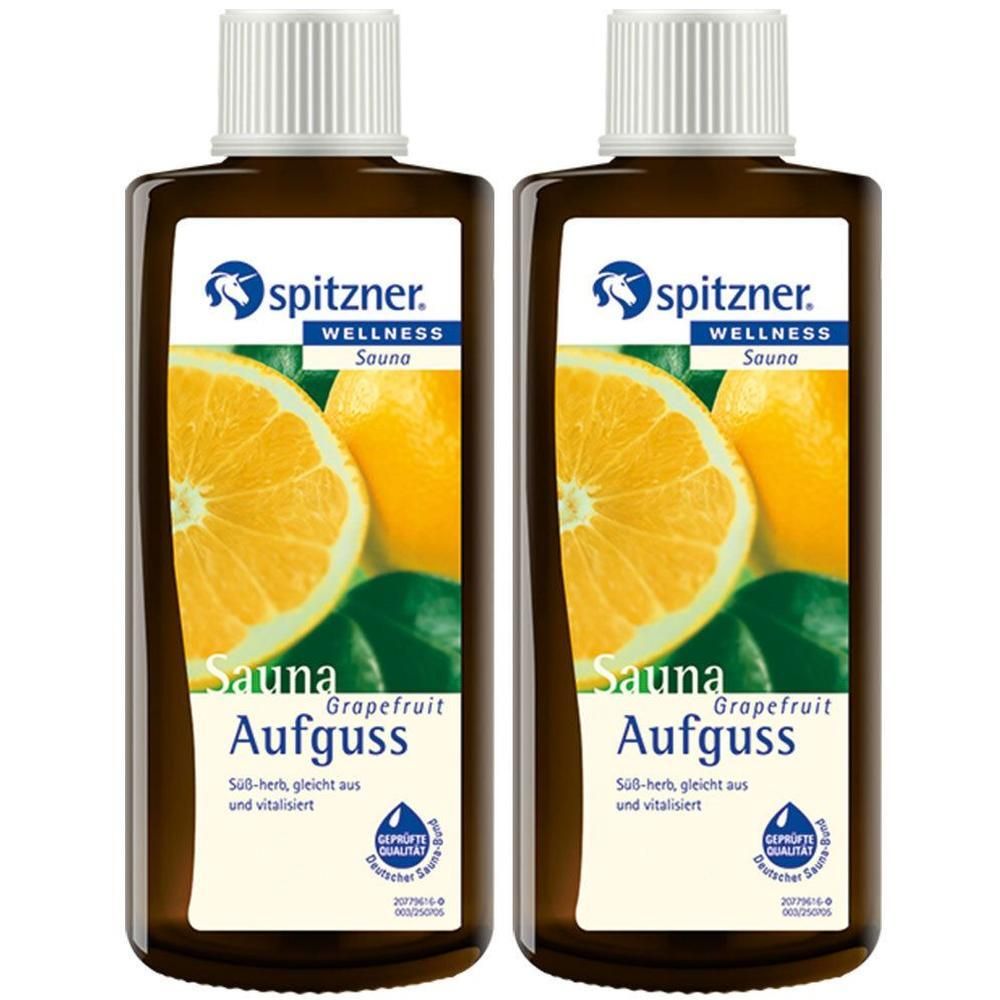 Zwei braune Flaschen mit weißem Deckel. Auf dem Etikett: Spitzner Wellness Sauna Aufguss Grapefruit. Abbildung einer Grapefruit.