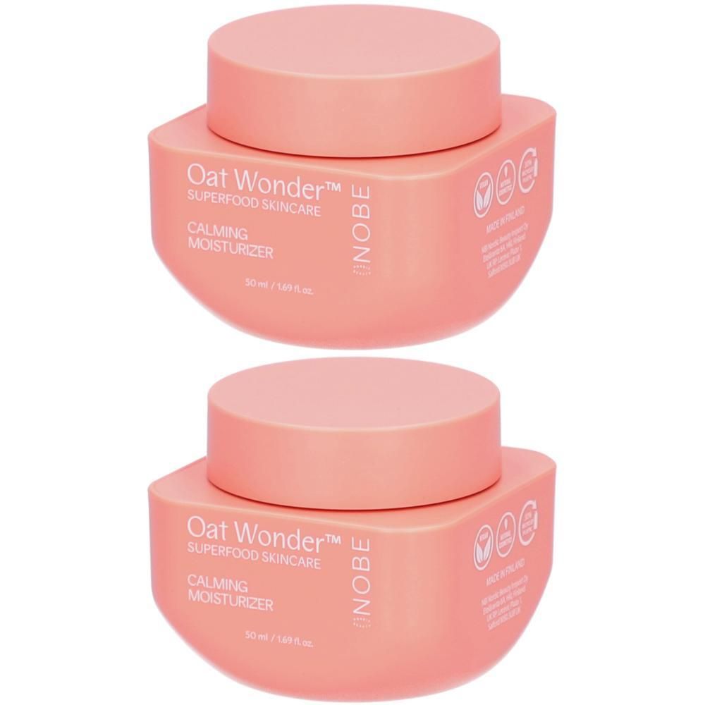 Zwei rosa Tiegel mit Deckel. Aufschrift: Oat Wonder, Calming Moisturizer. Marke NOBE. Vegan-Siegel.