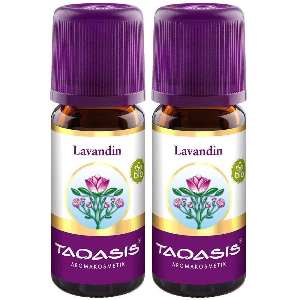 Zwei braune Glasflaschen mit lila Deckeln. Auf den Etiketten steht "Lavandin" und "TAOASIS Aromakosmetik". Bio-Siegel.