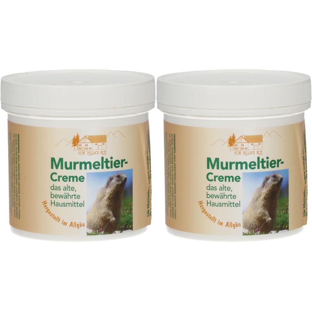 Zwei Cremetiegel mit weißem Deckel. Auf den Etiketten steht "Murmeltier-Creme". Darunter ein Murmeltier-Bild. Text: "das alte, bewährte Hausmittel".