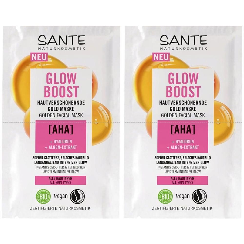 Zwei Beutel mit goldener Gesichtsmaske. Aufschrift: GLOW BOOST, AHA, Hyaluron & Algen-Extrakt. Marke: SANTE. Bio- und Vegan-Siegel.