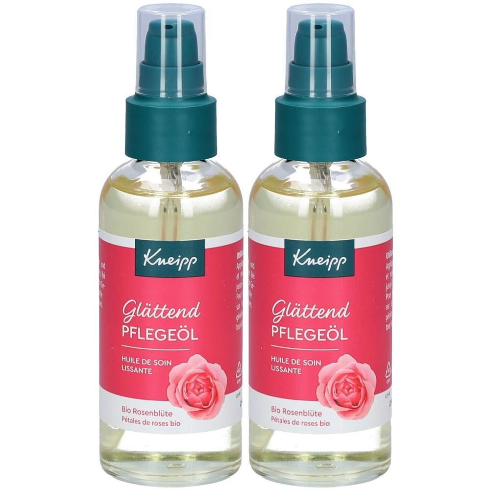Zwei Flaschen Pflegeöl mit Sprühkopf. Rote Etiketten mit Produktnamen und Rosenblüten-Abbildung. Marke Kneipp.