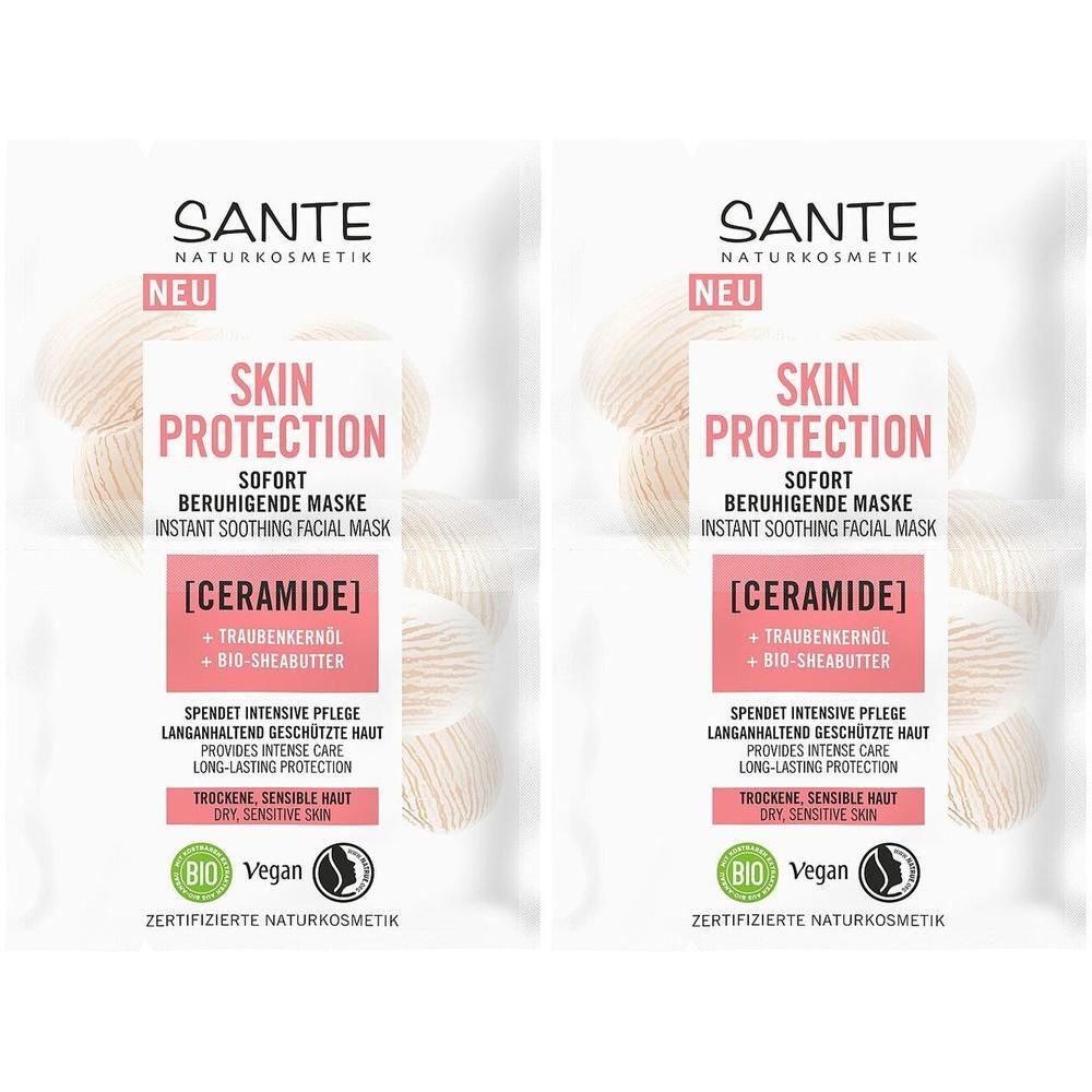 Zwei weiße Beutel mit rosa Text. Aufschrift: SKIN PROTECTION, SOFORT BERUHIGENDE MASKE. Enthält Ceramide, Traubenkernöl, Bio-Sheabutter. Vegan.