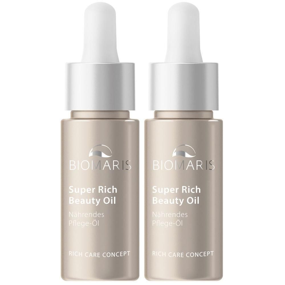 Zwei Flakons BIOMARIS Super Rich Beauty Oil. Beige Glasflaschen mit silbernen Deckeln und Pipetten. Beschriftung: Super Rich Beauty Oil, Nährendes Pflege-Öl.