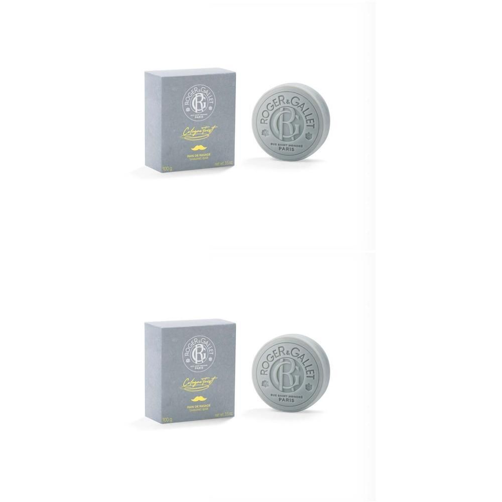 Graue Rasierseife und Verpackung. Auf der Verpackung Logo und Schriftzug. Runde Seife mit Logo. Beide Produkte stehen nebeneinander.