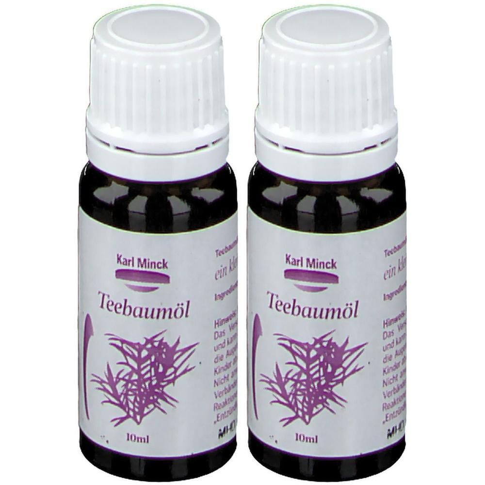 Zwei Flaschen Karl Minck Teebaumöl. Braune Glasflaschen mit weißen Deckeln und Etiketten. Aufschrift: Teebaumöl, 10ml.
