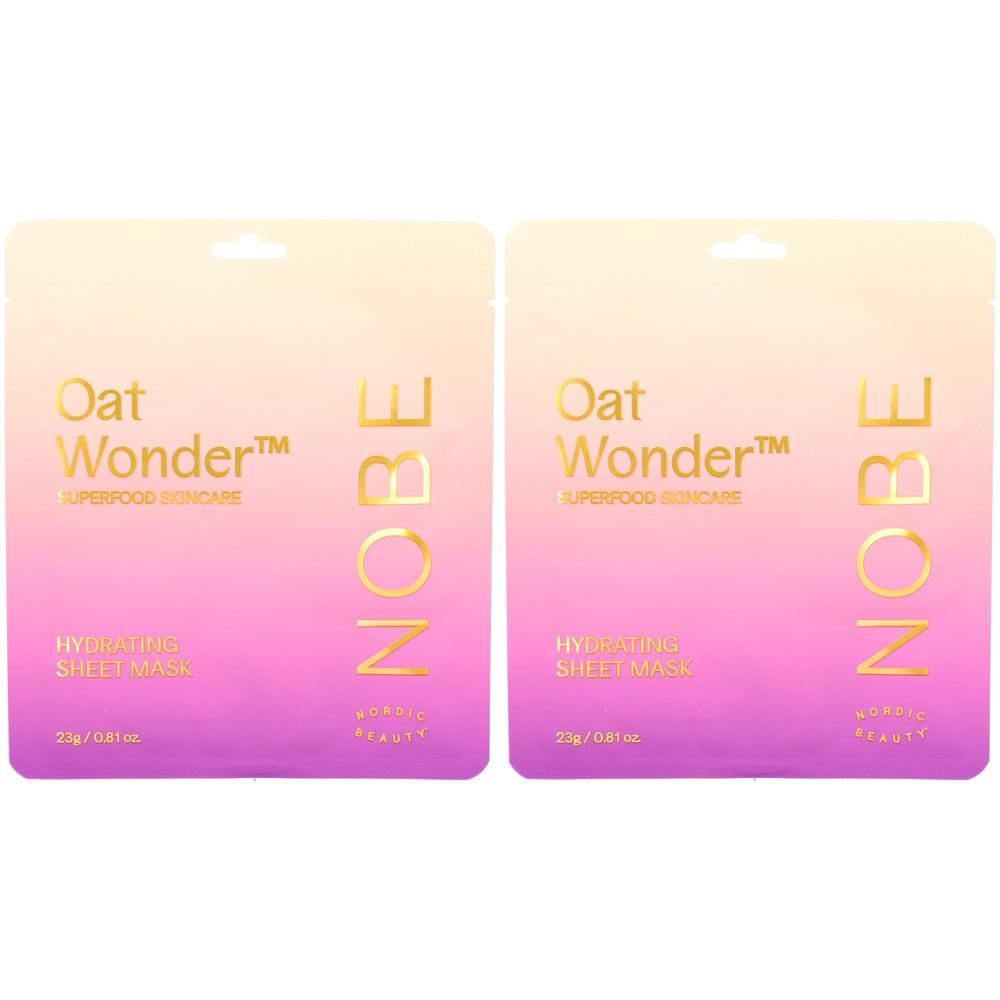 Zwei Beutel mit Feuchtigkeitsspendende Tuchmaske. Aufschrift: Oat Wonder, NOBE. Farbverlauf von Gelb nach Rosa. Mit Aufhängevorrichtung.