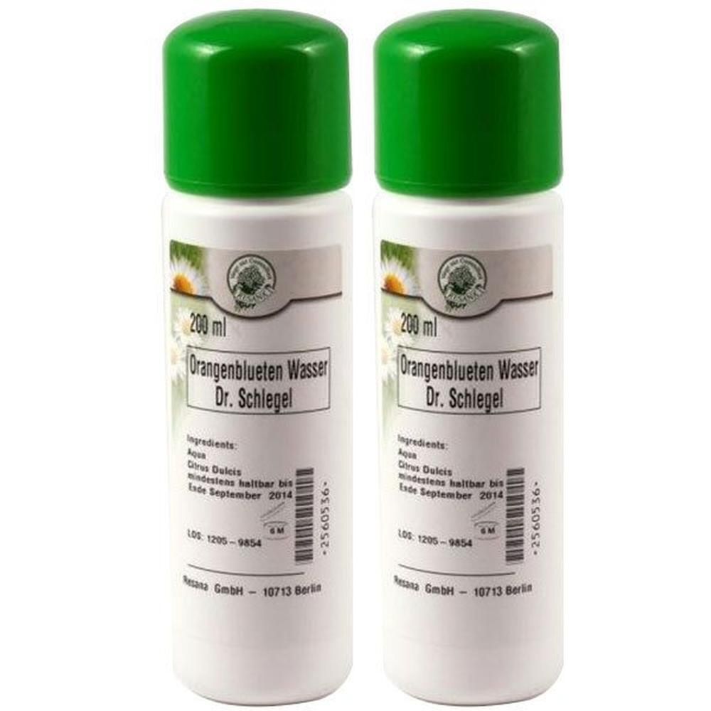 Zwei weiße Flaschen mit grünen Deckeln. Aufschrift: Orangenblütenwasser Dr. Schlegel, 200 ml. Etikett mit Inhaltsstoffen und Haltbarkeitsdatum.
