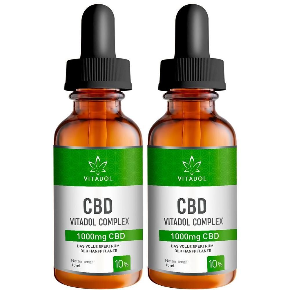 Zwei Flaschen Vitadol Complex 10% CBD. Braune Glasflaschen mit grünen Etiketten. Schwarze Pipettenaufsätze.