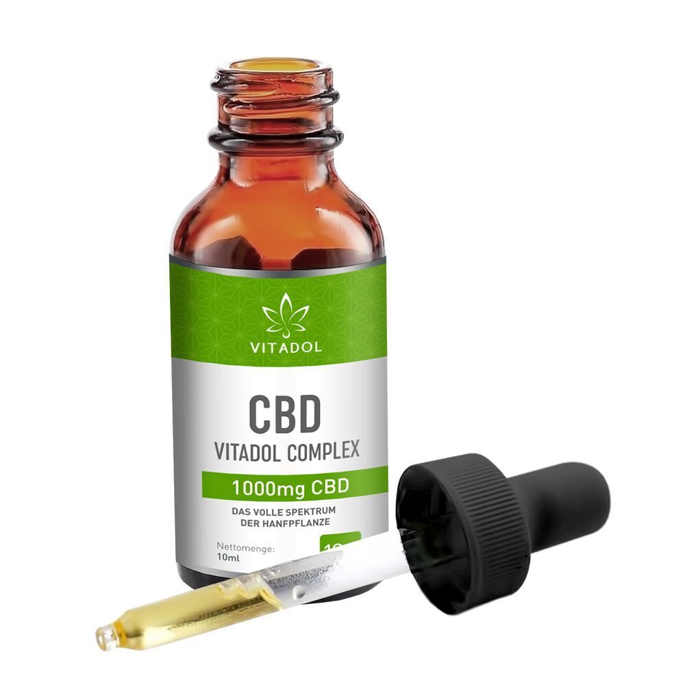 Vitadol Complex 10% CBD Flasche mit Pipette. Braune Glasflasche mit grünem Etikett. Pipette liegt daneben.