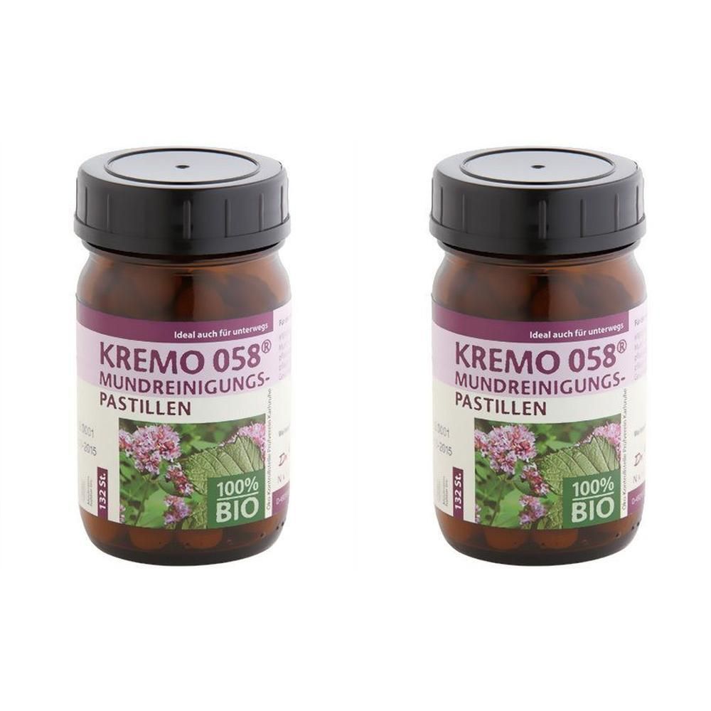 Zwei braune Glasflaschen mit schwarzen Deckeln. Auf den Etiketten steht "KREMO 058 Mundreinigungs-Pastillen" und "100% BIO".
