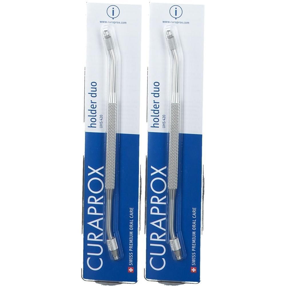Zwei Halter duo UHS 420 in Verpackung. Silberfarbene, gebogene Metallgriffe mit geriffelter Oberfläche. Marke: CURAPROX.