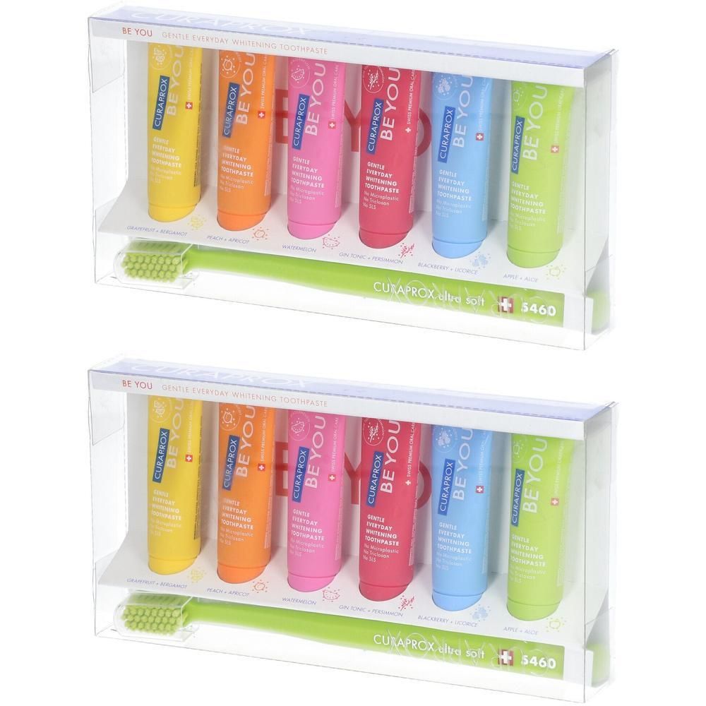 Zahnpasta-Set mit sechs Tuben in verschiedenen Farben und einer Zahnbürste in einer transparenten Verpackung.