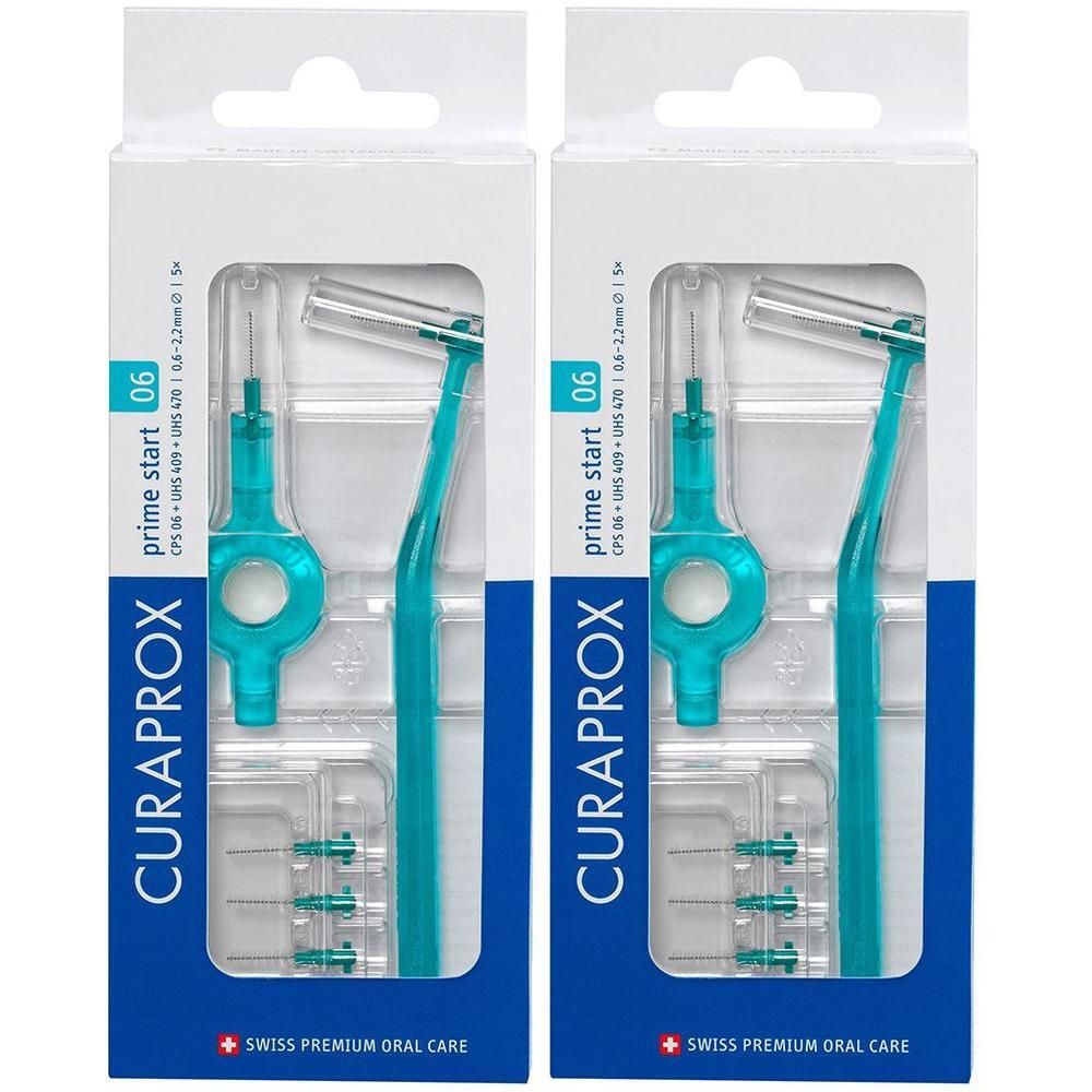 Zwei Packungen Interdentalbürsten. Jede Packung enthält Halterung und Bürsten. Türkisfarbene Bürsten und Halterungen. Verpackung mit Produktnamen.