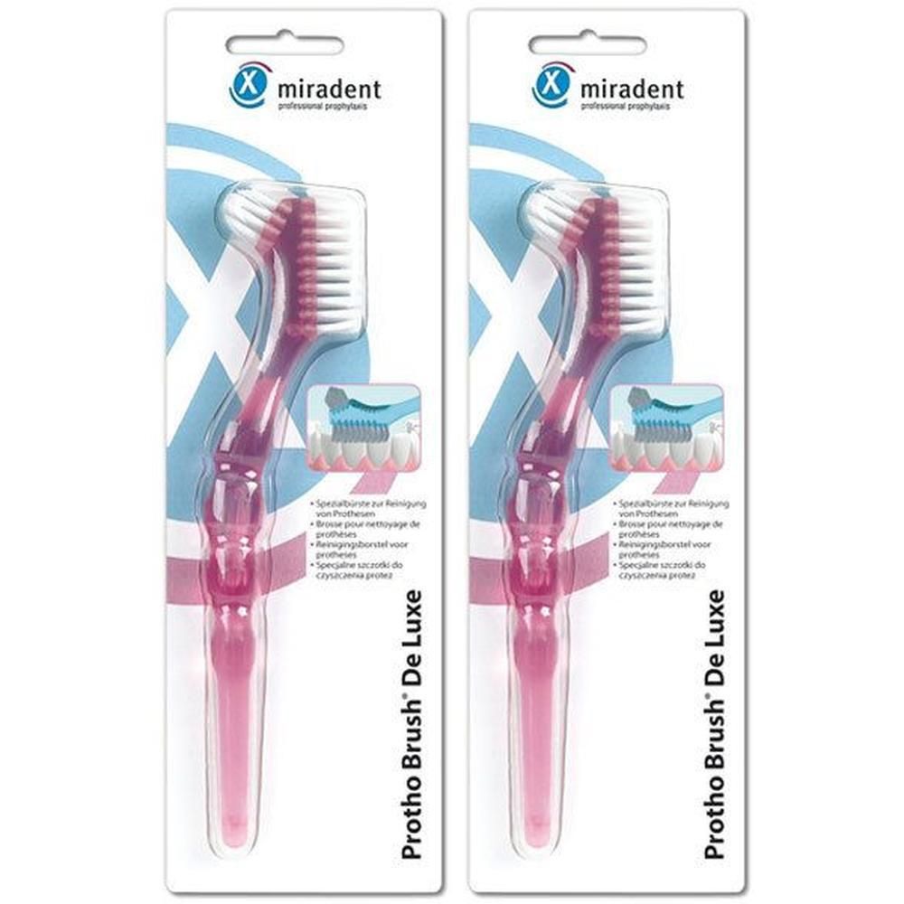 Zwei Prothesenbürsten in pinker Verpackung. Marke miradent. Protho Brush De Luxe. Spezielle Borsten für die Reinigung.