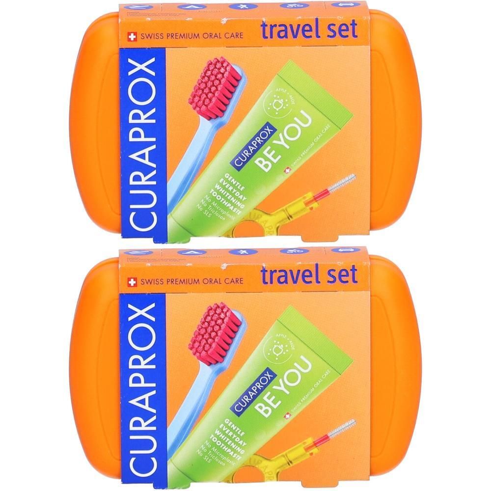 Zwei Curaprox Reise-Sets mit Zahnbürste und Zahnpasta in orangefarbener Hülle.