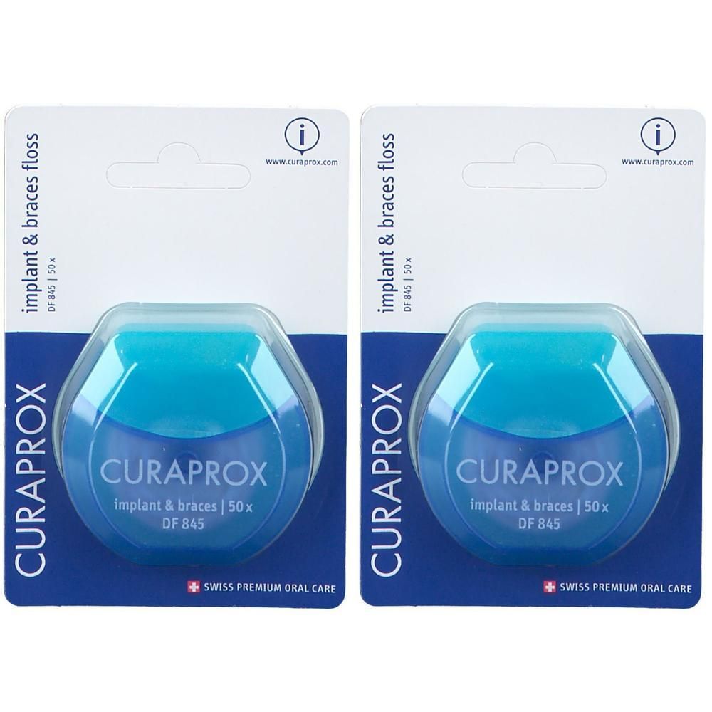 Zwei blaue Zahnseide-Spender mit weißer Verpackung. Aufschrift: CURAPROX, implant & braces, DF 845. Swiss Premium Oral Care.