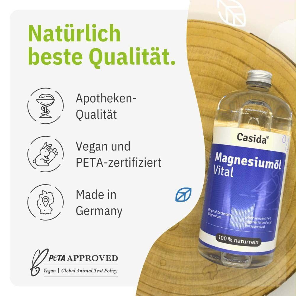 Flasche Magnesiumöl Vital auf Holz. Text: Apotheken-Qualität, Vegan und PETA-zertifiziert, Made in Germany.