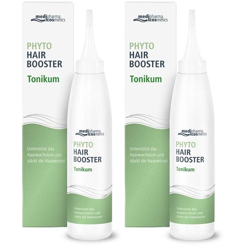 Zwei Flaschen und Verpackungen von Phyto Hair Booster Tonikum. Weißes Fläschchen mit Applikator, grüne Verpackung.
