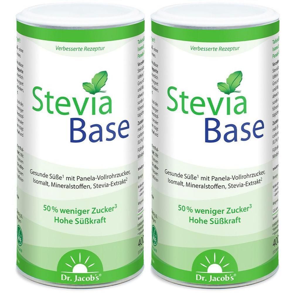 Zwei zylindrische Dosen STEVIABASE. Weiß, grün und blau. Aufschrift: Stevia Base, 50% weniger Zucker, Dr. Jacob's.