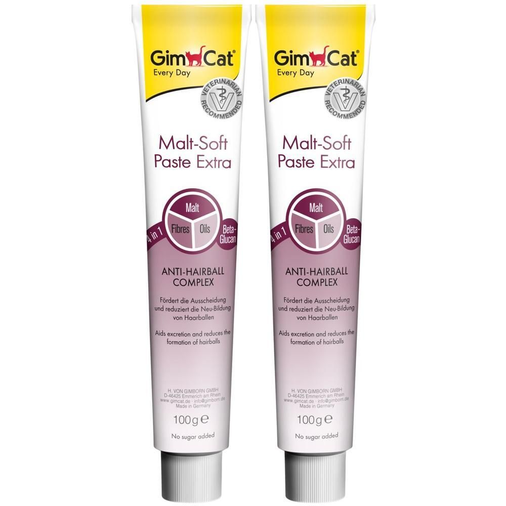 Zwei Tuben Paste mit Aufschrift 'Malt-Soft Paste Extra'. Gelbe und weiße Verpackung. Enthält Malt, Fasern, Öle und Beta-Glucan. 100g.