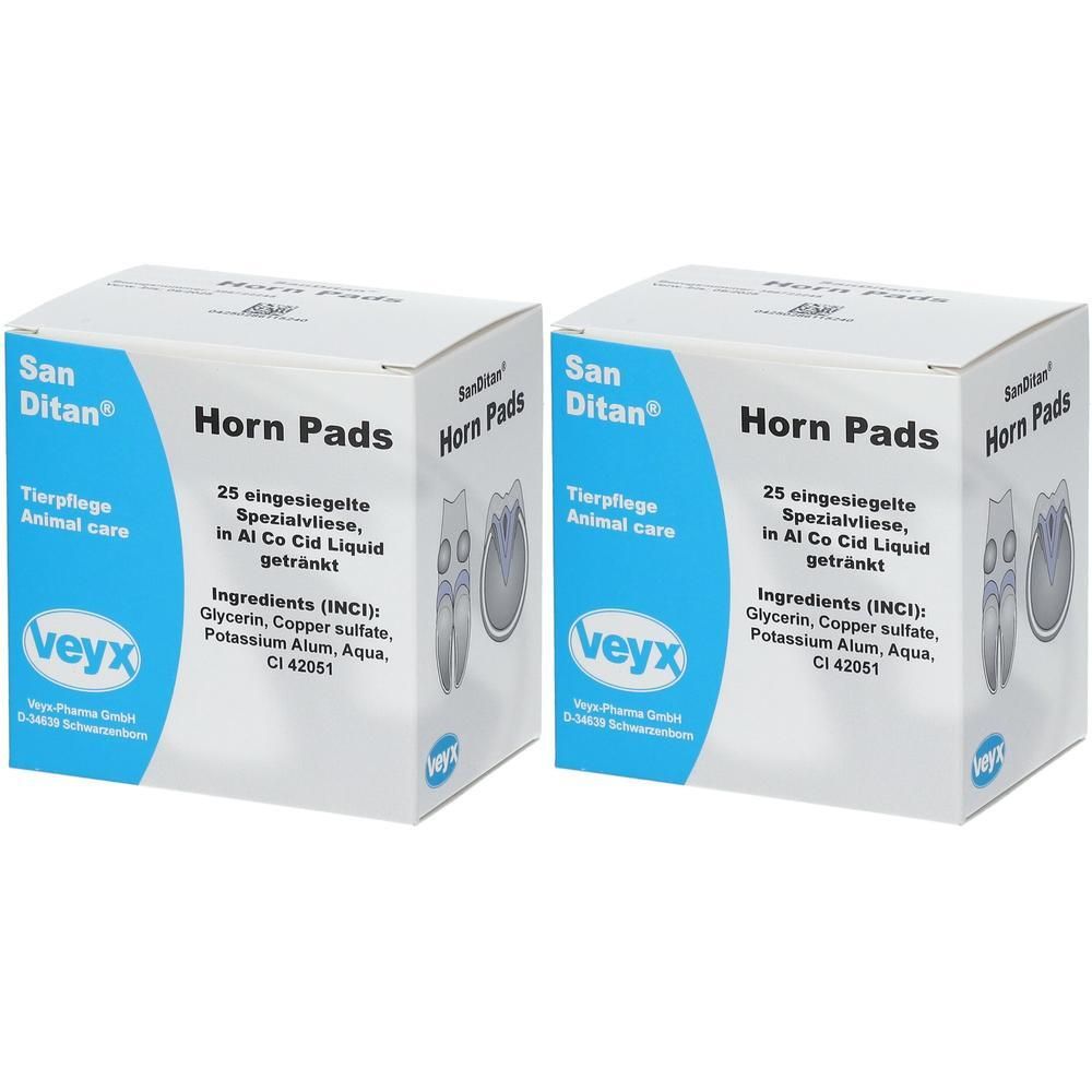 Zwei Kartons mit "Horn Pads". Aufschrift: "San Ditan", "Tierpflege", "25 eingesiegelte Spezialvliese". Blaue und weiße Verpackung mit Produktnamen.
