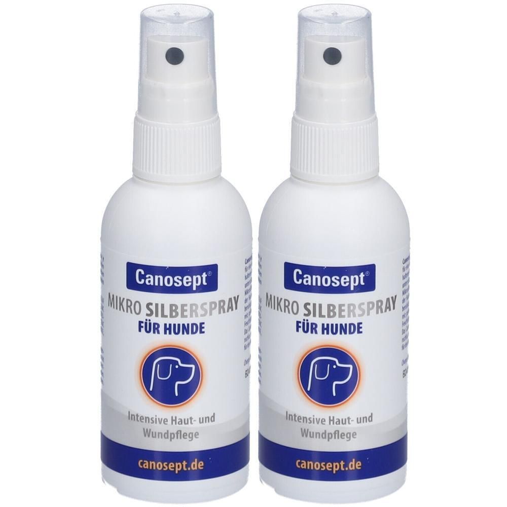 Zwei weiße Sprühflaschen mit dem Aufdruck "Canosept Mikro Silberspray für Hunde". Blaue Etiketten mit Hundesymbol und Text.