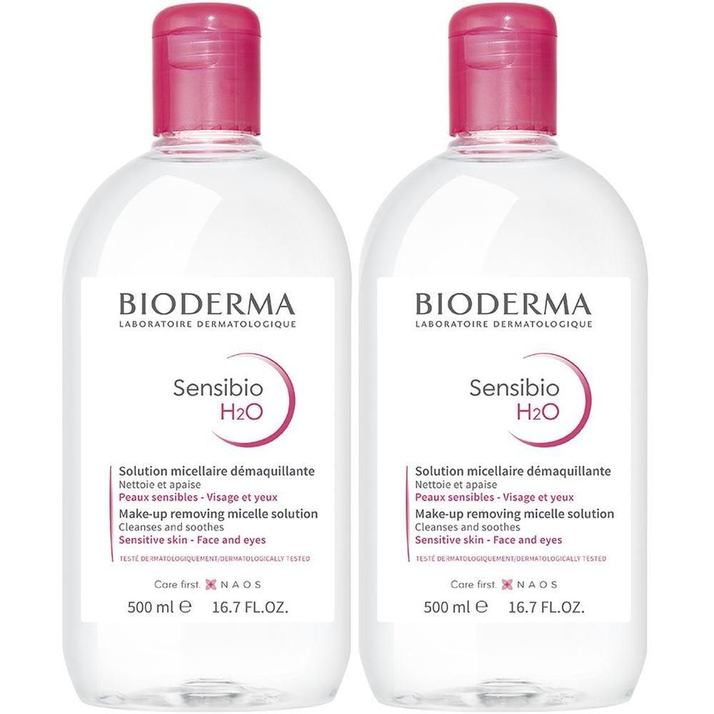 Zwei Flaschen BIODERMA Sensibio H2O Mizellenwasser, 500 ml, mit rosa Verschluss.