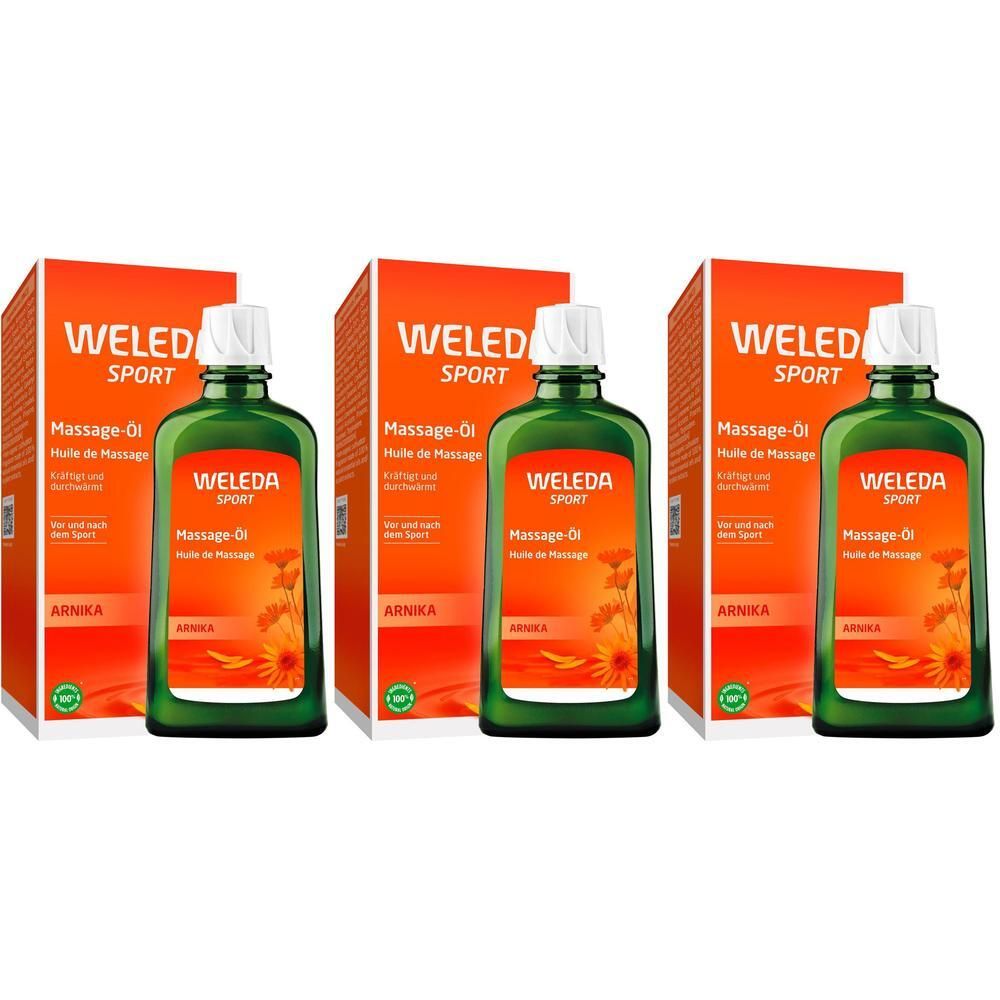 Drei Flaschen Weleda Arnika Massageöl mit Schachteln.