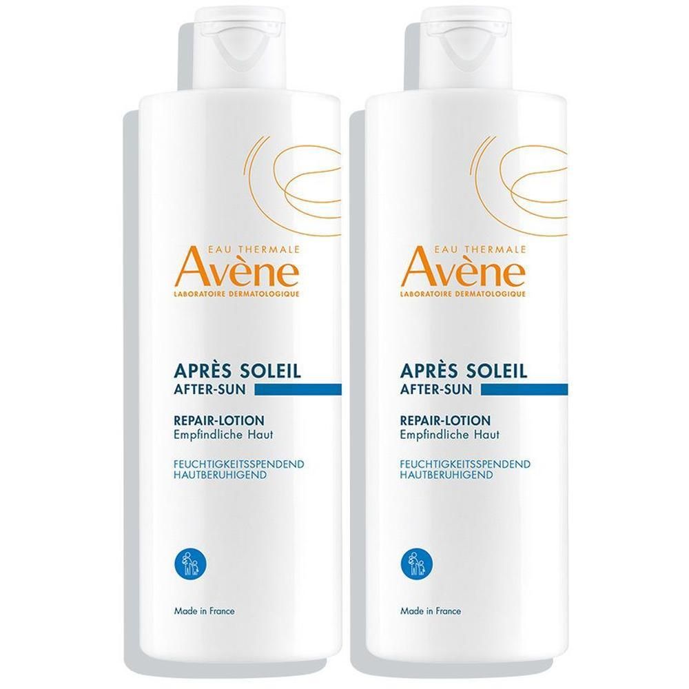 Zwei weiße Flaschen Avène After Sun Repair Lotion mit Klappdeckel. Beschriftung auf Deutsch.