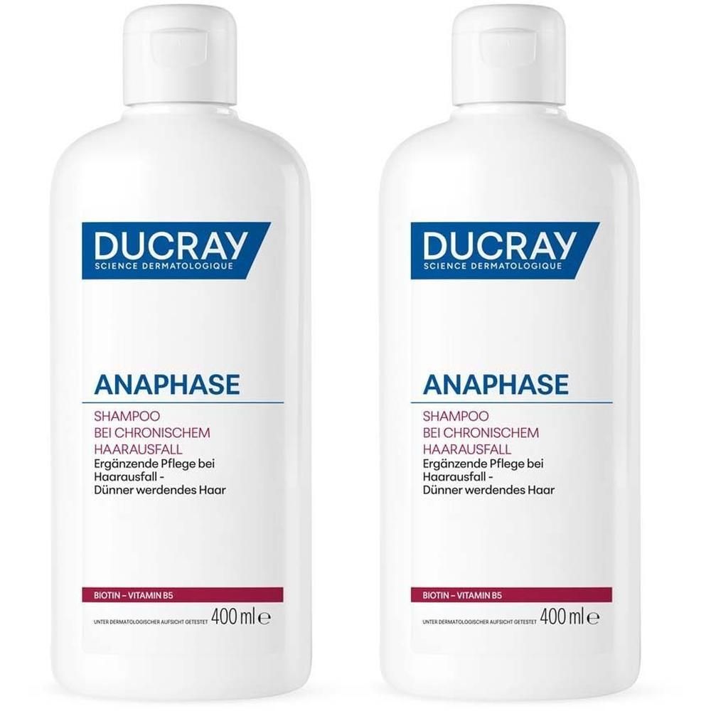 Zwei weiße Flaschen Ducray Anaphase Shampoo mit blauem Etikett.