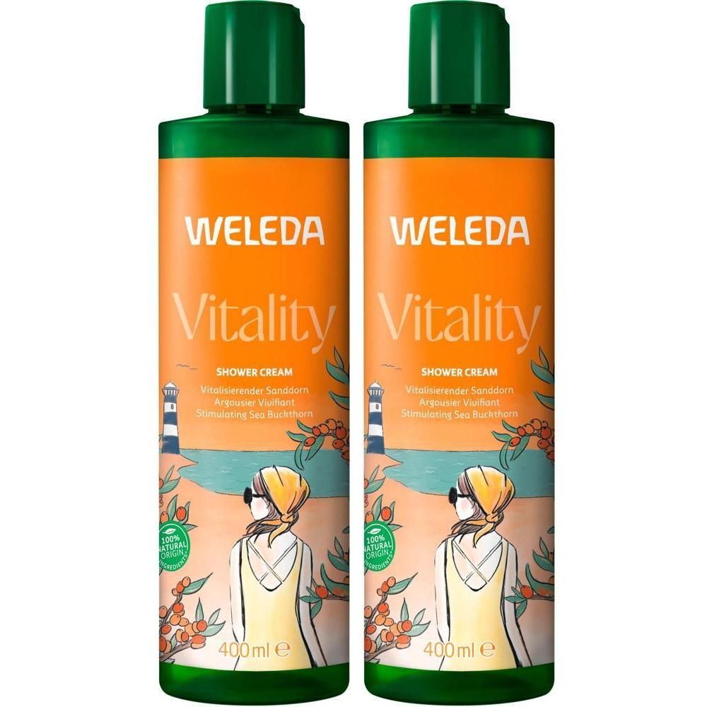 Zwei Flaschen Weleda Vitality Duschcreme Sanddorn, 400ml. Vorderansicht mit Strandmotiv.