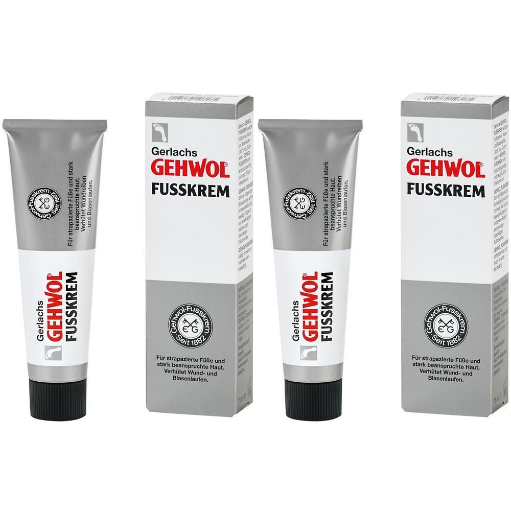 Zwei Tuben und zwei Kartons GEHWOL FUSSKREM mit schwarzem Deckel. Silberne Tuben mit rotem und weißem Aufdruck.