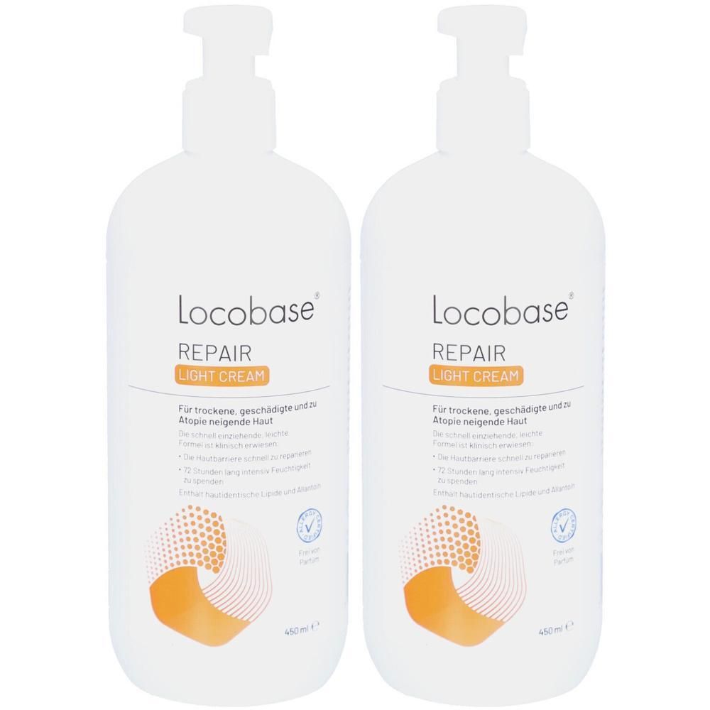 Zwei weiße Pumpflaschen Locobase Repair Light Cream mit orange-weißem Designelement.