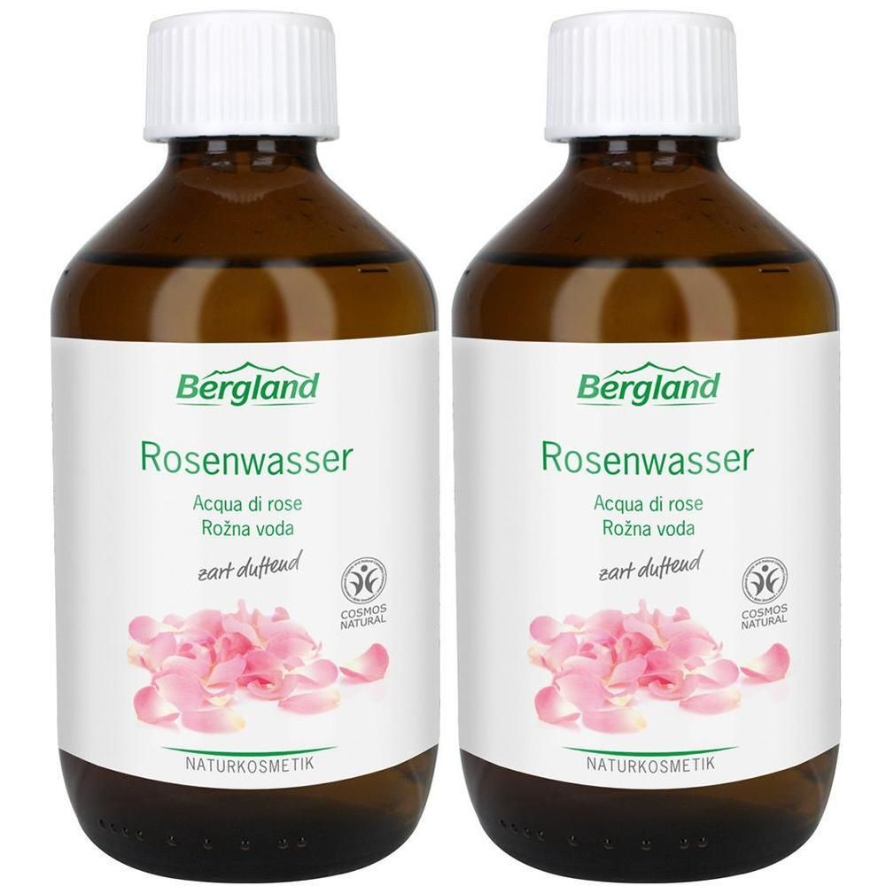 Zwei Flaschen Bergland Rosenwasser mit weißen Verschlüssen und Etiketten, die Rosenblätter zeigen.