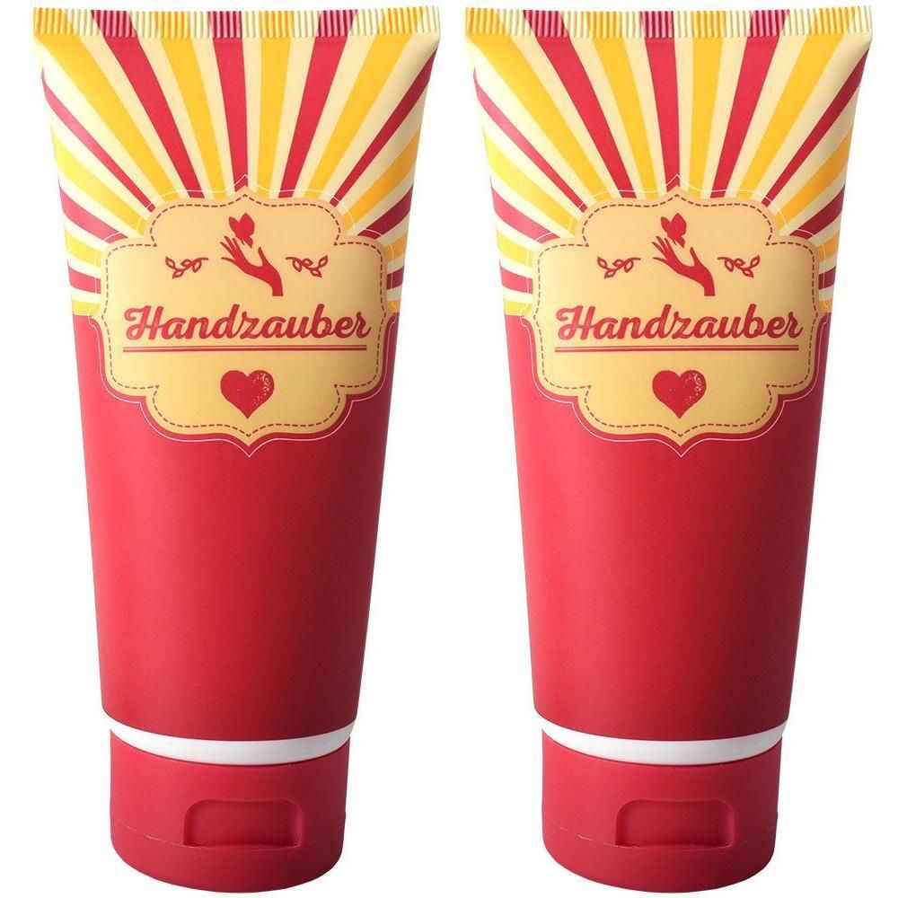 Zwei rote Tuben Handcreme mit gelb-rotem Strahlenmuster und dem Schriftzug "Handzauber".