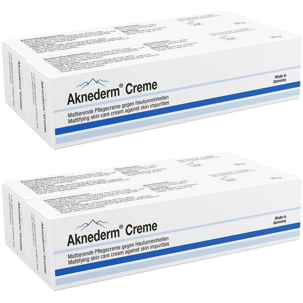 Zwei Packungen Aknederm Creme mit mattierender Pflegecreme gegen Hautunreinheiten.