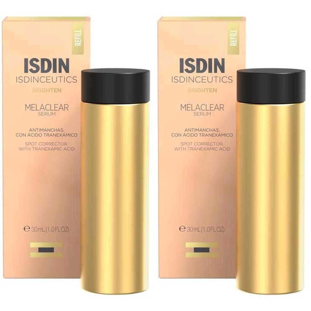 Zwei goldene Flaschen ISDIN ISDINCEUTICS Melaclear Serum mit Schachteln.