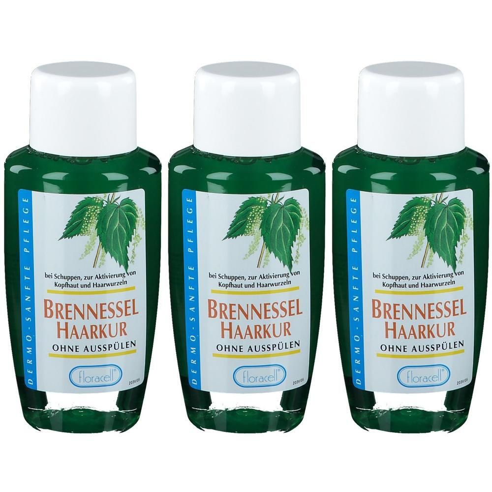 Drei Flaschen Brennessel Haarkur von Floracell mit weißen Verschlüssen und grünen Etiketten mit Brennnesselmotiv.