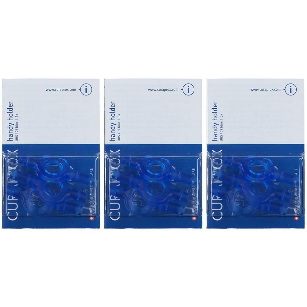Drei Packungen mit blauen Interdentalbürstenhaltern. Jede Packung enthält mehrere Halter.