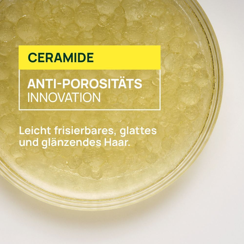 Nahaufnahme von Ceramid-Formel mit Text über Anti-Porosität und glattes Haar.