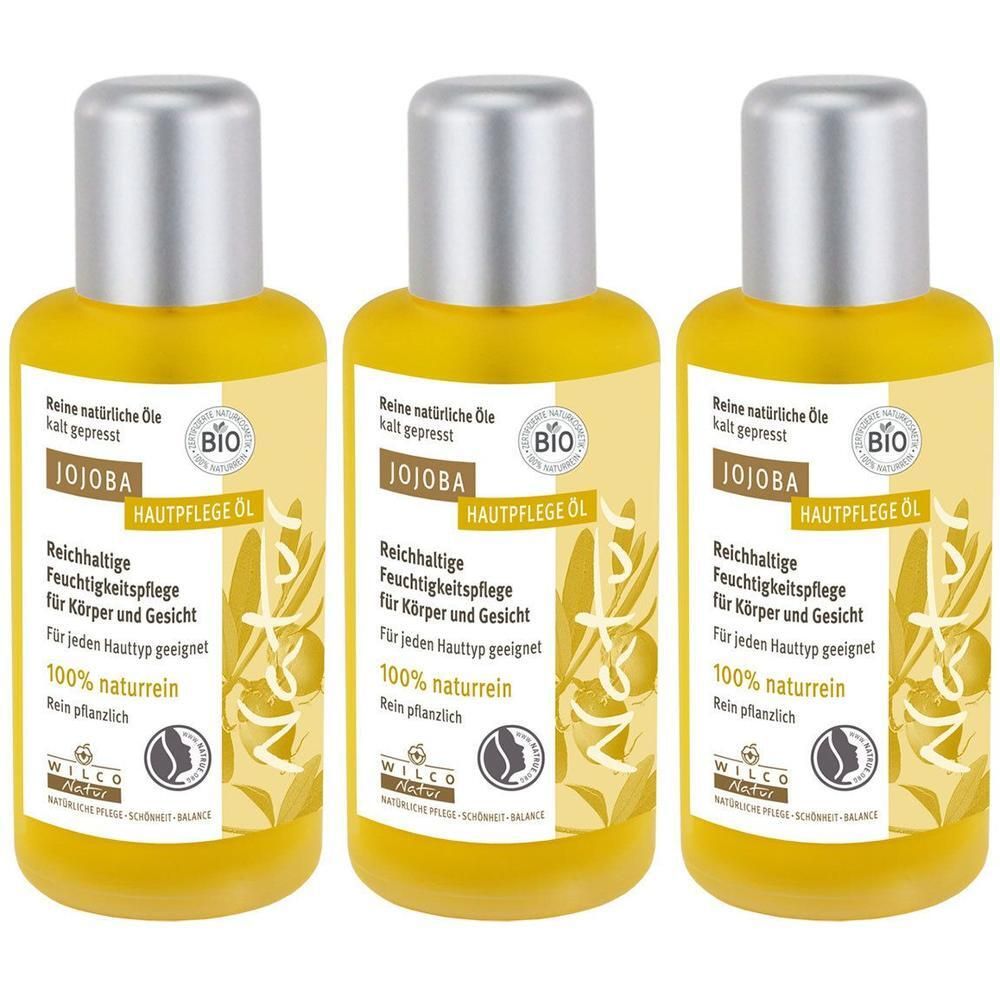 Drei Flaschen Wilco Natur Jojoba BIO Hautpflege Öl nebeneinander.