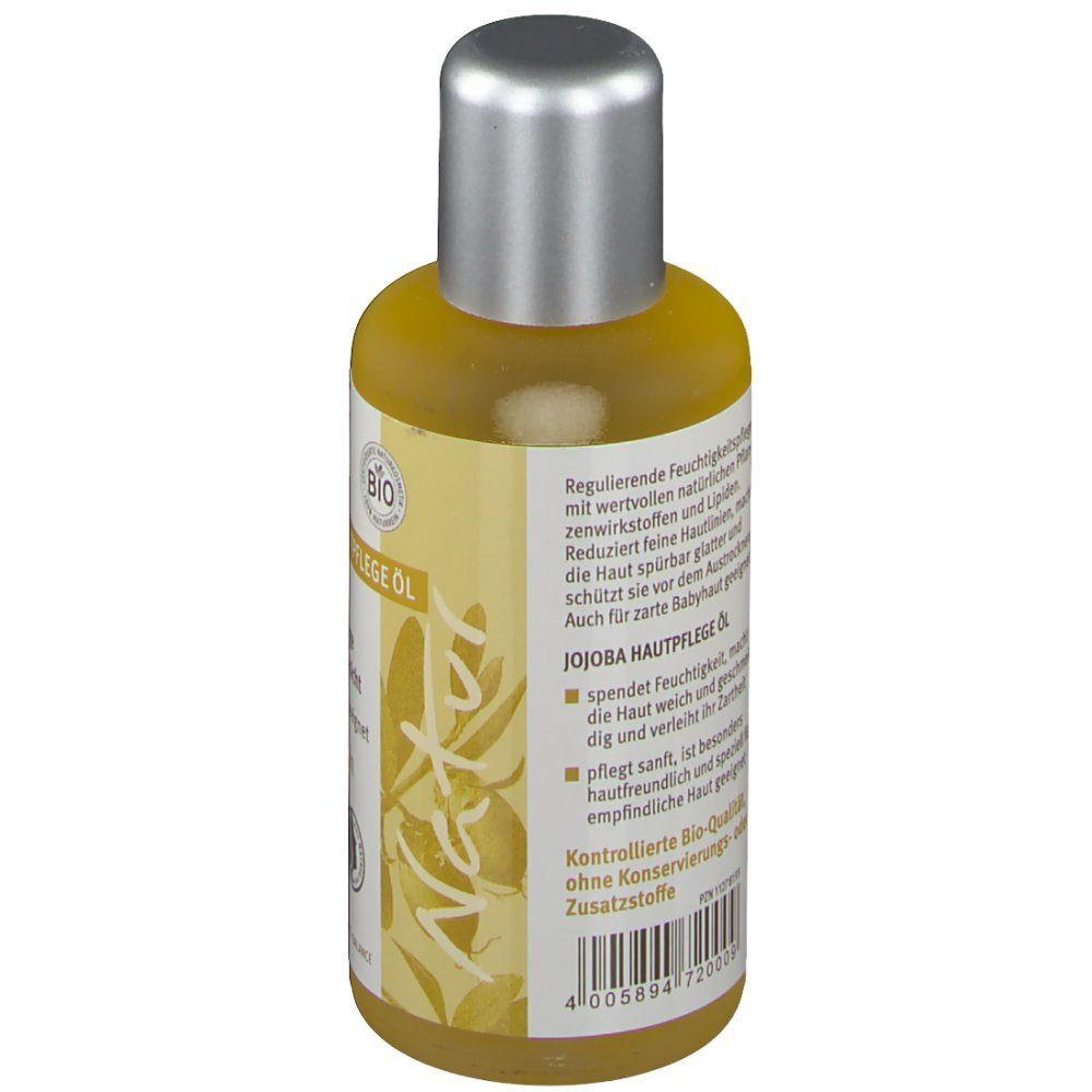 Rückseite einer Flasche Wilco Natur Jojoba BIO Hautpflege Öl mit Inhaltsstoffen und Anwendungshinweisen.
