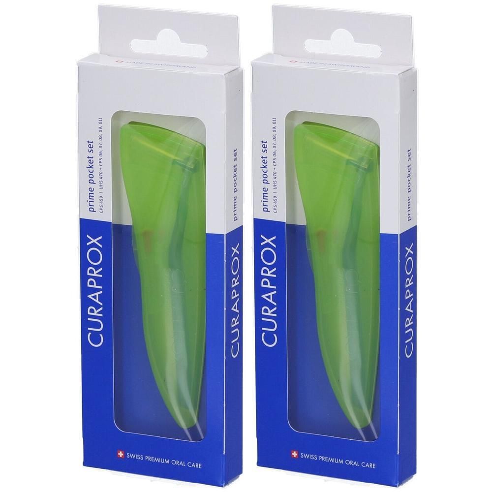 Zwei Curaprox Prime Pocket Sets in grünen Hüllen, verpackt in weißen Kartons mit blauen Akzenten.