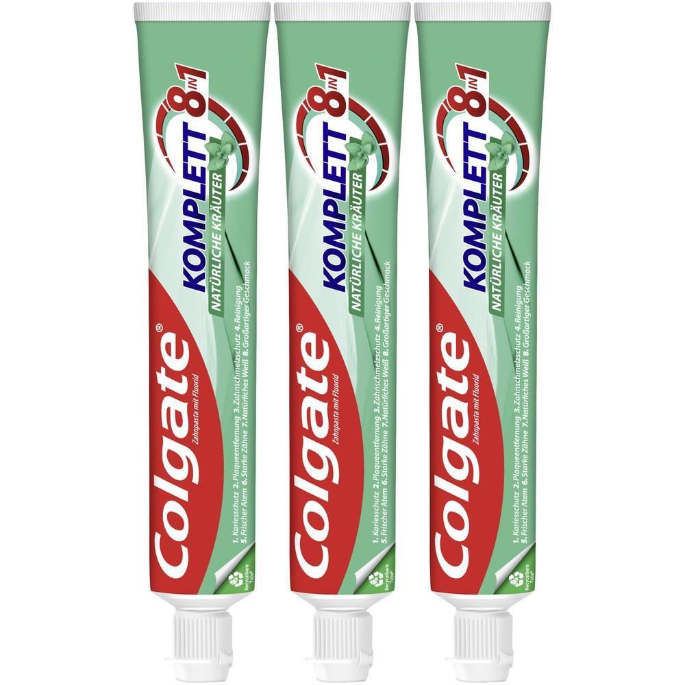 Drei Tuben Colgate Komplett 8 in 1 Natürliche Kräuter Zahnpasta nebeneinander.