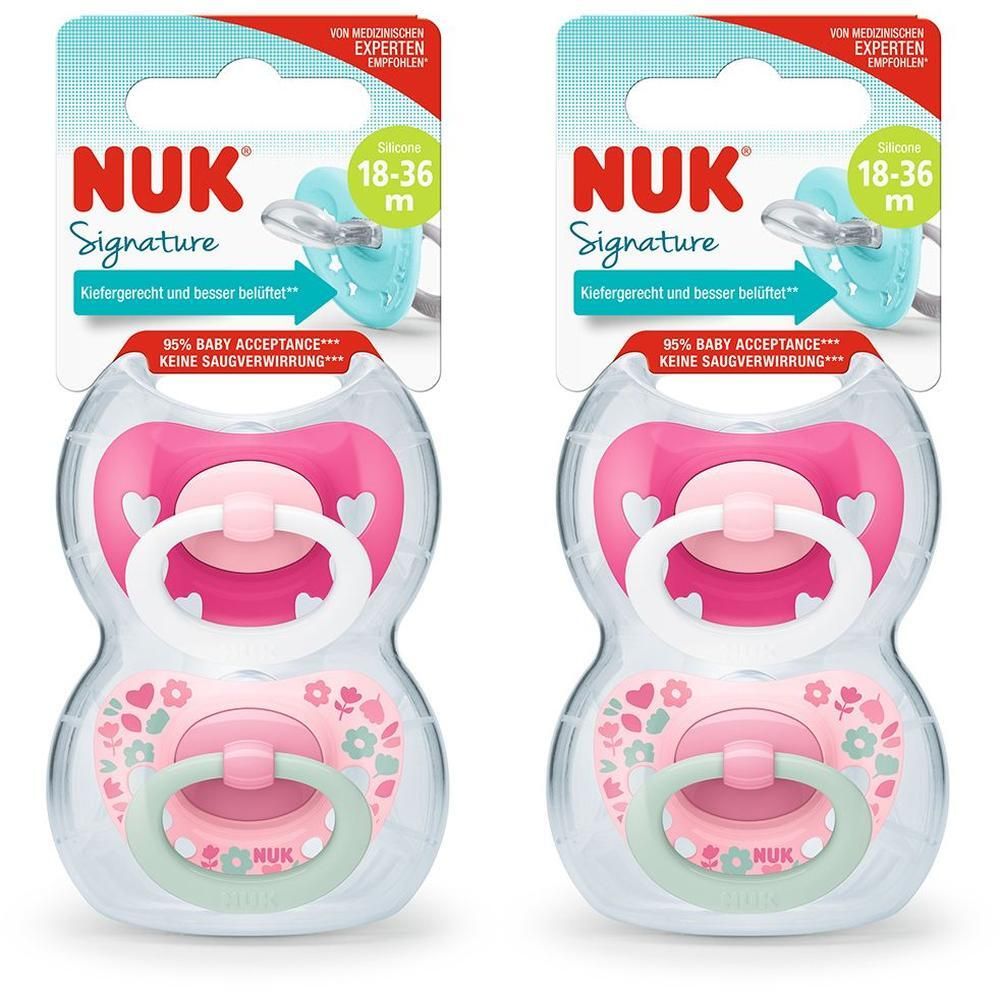 Zwei NUK Signature Schnuller 18-36 Monate in Rosa mit Herz- und Blumenmuster, verpackt.