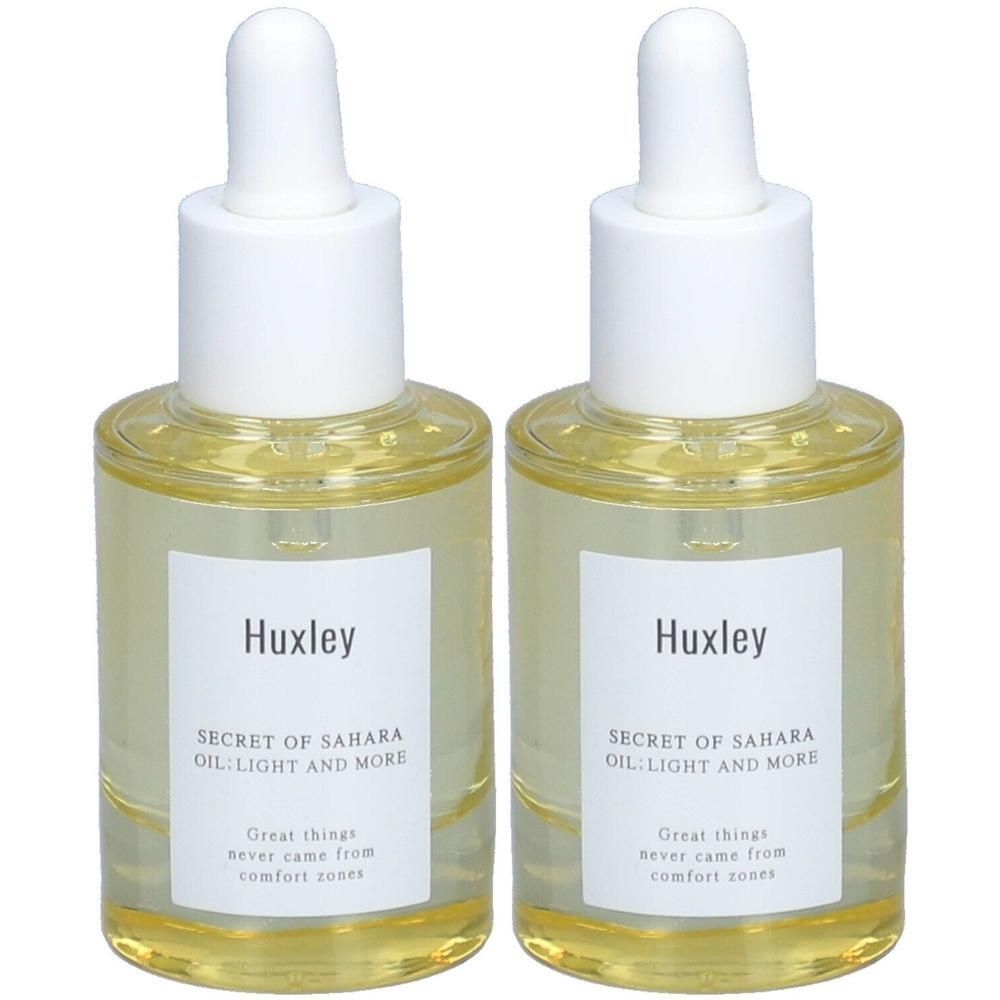 Zwei Flaschen Huxley Secret of Sahara Oil Light and More mit Pipettenverschluss.